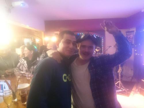 two men are posing for a picture in a room at Le Grand Chatelard HÔTEL BAR RESTAURANT in Sainte-Marie-de-Cuines