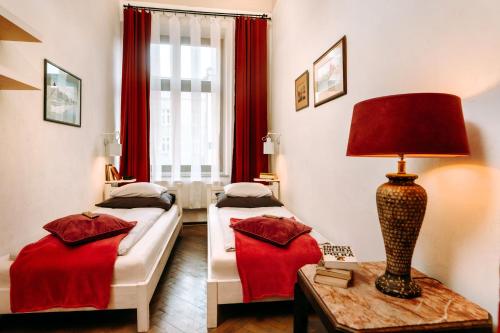 En eller flere senge i et værelse på Apartament Rynek Staromiejski