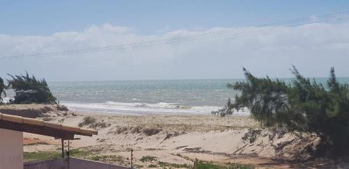 a view of a beach with the ocean at Paraiso de Maracajau 1 in Maracajaú