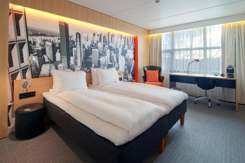 En eller flere senge i et værelse på Thon Hotel Bergen Airport