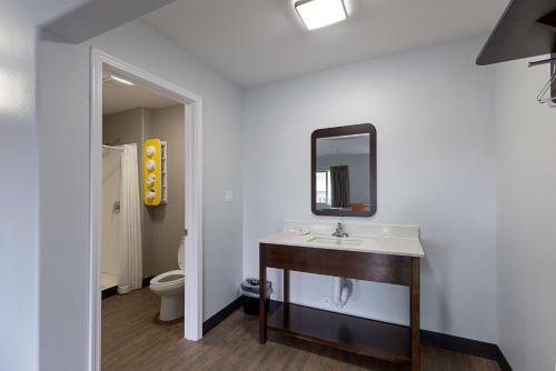a bathroom with a sink and a mirror at Motel 6-Show Low, AZ in Show Low