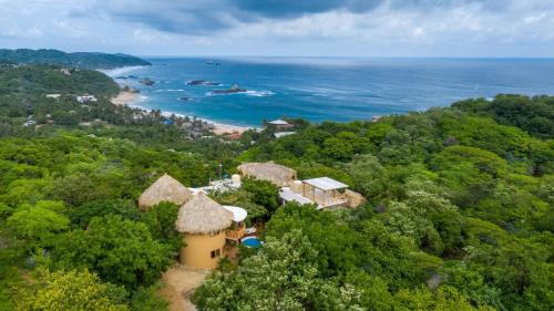 an aerial view of a resort and the ocean at Carpe Diem Casitas & Villas Mazunte in Mazunte