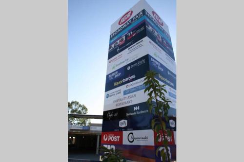 a tall building with many signs on it at B5 Crawley Apartment 1 BRM & Sleepout near UWA in Perth