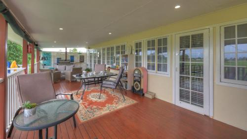 a porch with a table and chairs on a deck at Andavine House - Bed & Breakfast in Grafton