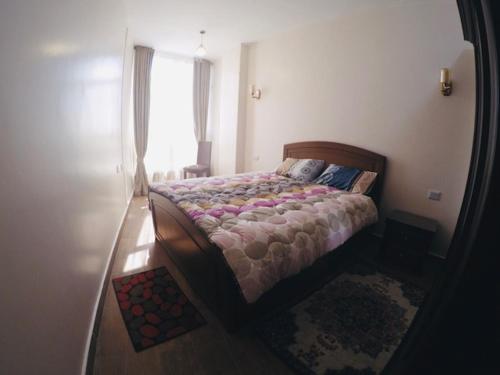 מיטה או מיטות בחדר ב-Your comfort home in Hurghada with pool, WIFI, AC, walk to beach