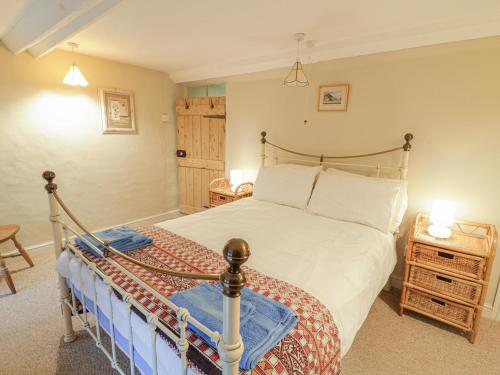 a bedroom with a large bed in a room at Haulfryn in Llangynog