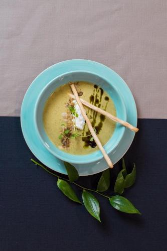 a bowl of soup with chopsticks on a table at Szafirowy Dwór Hotel & Restauracja in Gliwice