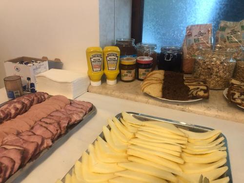 a counter with various food items on a table at Chalet 173 in Gura Humorului