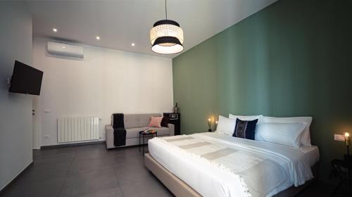 Posteľ alebo postele v izbe v ubytovaní Zefiro Suites