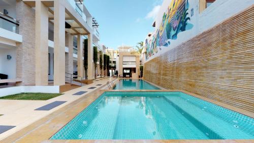 a swimming pool in the middle of a building at The District Boracay in Boracay