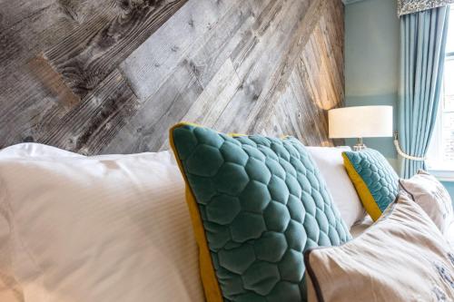 a room with a couch and a wooden wall at City Gate in Exeter