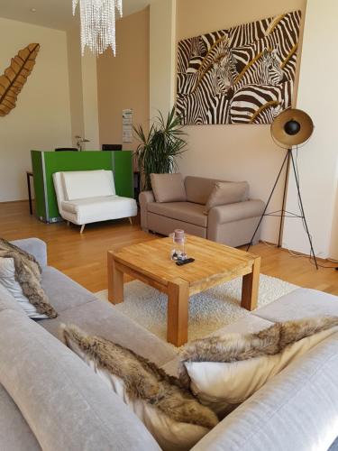 a living room with a couch and a coffee table at Tillyhome in Nürnberg