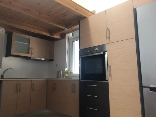 A kitchen or kitchenette at Villanova Rhodes Comfy Apartment