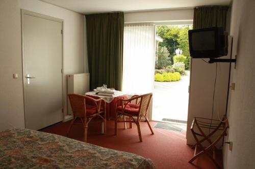TV a/nebo společenská místnost v ubytování Motel Koolen