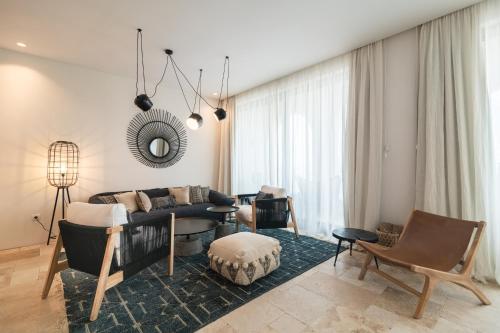 Coin salon dans l'établissement Villa Chinka by Astor Garden Hotel - Adults Only