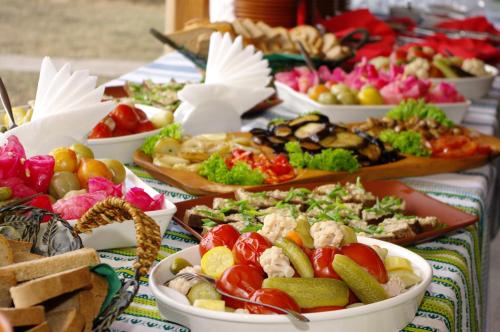 a buffet of different types of food on a table at Hotel Mirage in Sudovaya Vishnya