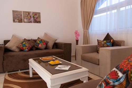 a living room with a couch and a coffee table at Swiss Royal DAHAB in Dahab