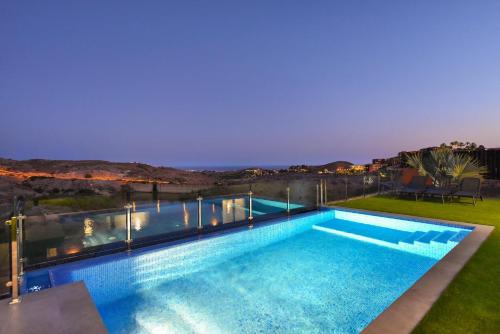a swimming pool on the roof of a house at Top Salobre Villas by VillaGranCanaria in Salobre