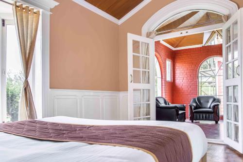 Ένα ή περισσότερα κρεβάτια σε δωμάτιο στο Pine View Stay Ooty
