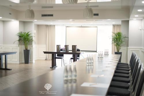 a conference room with a long table and chairs at Pod Platanem Gliwice in Gliwice