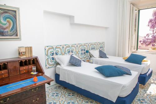 Кровать или кровати в номере Villa Scarlato