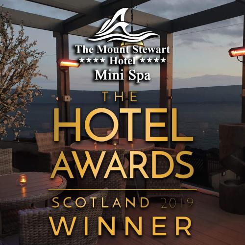 a sign for the hotel awards at the mountain serpent hotel mint spa at Mount Stewart Hotel in Portpatrick