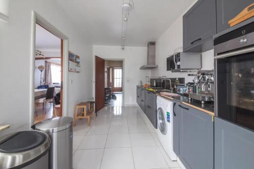 a kitchen with a counter and a dishwasher at Rustic room 15 mins from Brussels in Halle