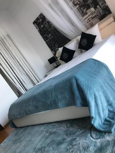 
Un pat sau paturi într-o cameră la Apartament Iris
