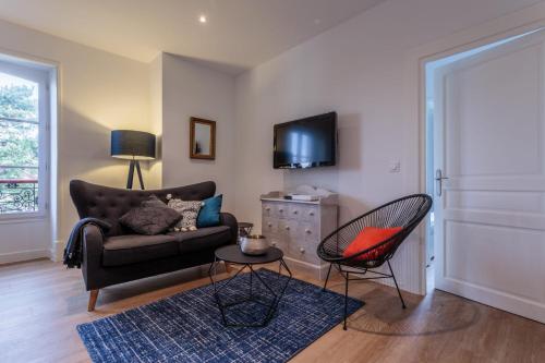 a living room with a couch and a chair at IZOKINA KEYWEEK 2 bedroom Apartment in Biarritz in Biarritz