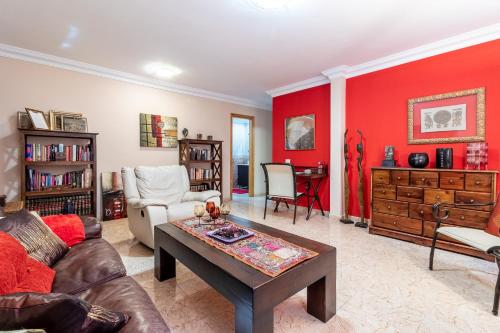 a living room with a couch and a table at Flatguest Ingenio + 2 Bdr + Wifi + 4PAX in Ingenio