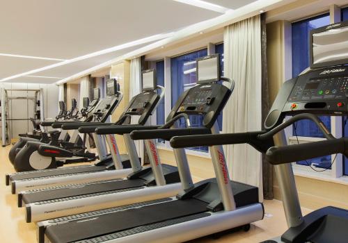 a row of treadmill machines in a gym at Crowne Plaza Nanjing Jiangning by IHG in Nanjing