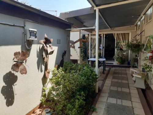 a house with a cat on the side of it at Lavender Lane in Ladysmith