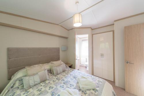 Ένα ή περισσότερα κρεβάτια σε δωμάτιο στο Willow Lodge