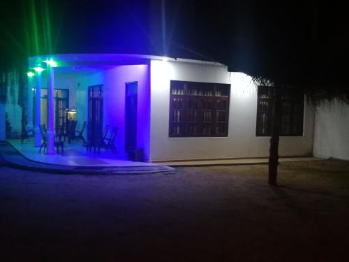 a building with colorful lights on it at night at Aurora Echo Villa in Matara