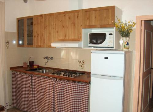 O bucătărie sau chicinetă la Trasimeno Panicale - Appartamento borgo storico