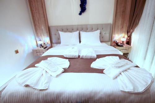 Ένα ή περισσότερα κρεβάτια σε δωμάτιο στο Butterfly Butik Hotel
