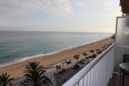 a view of the beach from the balcony of a condo at Apartaments El Sorrall in Blanes