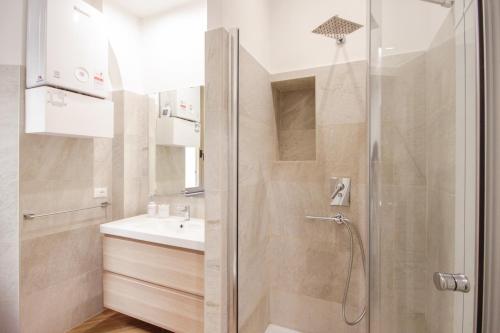 a bathroom with a shower and a sink at Home Vaticano 50 steps from Museum in Rome