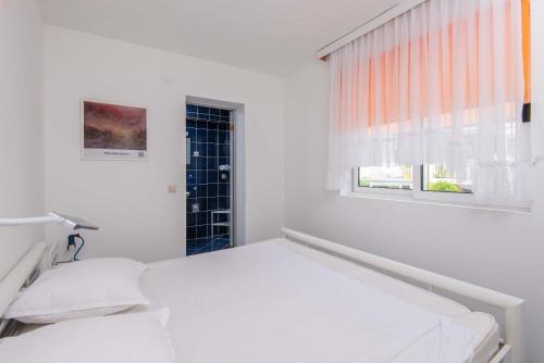 Posteľ alebo postele v izbe v ubytovaní Apartments Jane Perna