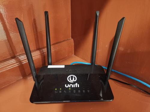 a black router sitting on top of a table at Shangrila House @ 香格里拉民宿 in Tawau