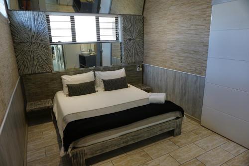 Cama ou camas em um quarto em 10 Coral Cove