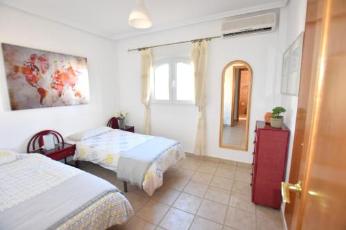 Postel nebo postele na pokoji v ubytování Casa Davagh Javea