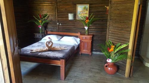 a bedroom with a woman laying on a bed at Hotel Rincón de la Vieja Lodge in Liberia