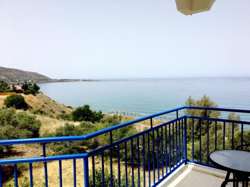 a balcony with a view of the ocean at A.A Michael Apartments in Pachyammos