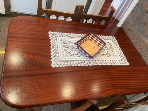 a wooden table with a box on top of it at Cala Tere 2on pis in Cadaqués