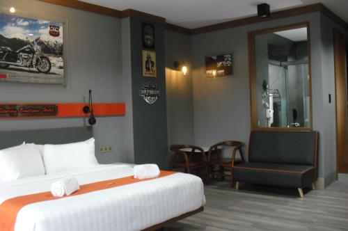 Ένα ή περισσότερα κρεβάτια σε δωμάτιο στο Sturgis Boutique Hotel Cipanas