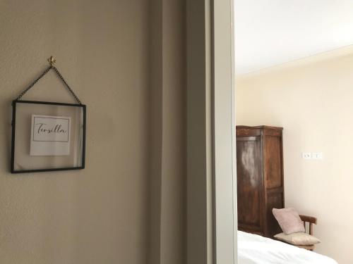 a bedroom with a bed and a picture on the wall at Corte Viviani in Brescia