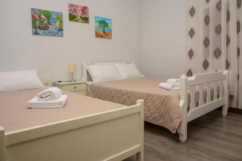 Postel nebo postele na pokoji v ubytování Stefanie's Rooms 2