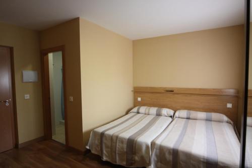 Cama o camas de una habitación en Hostal Restaurante El Silo