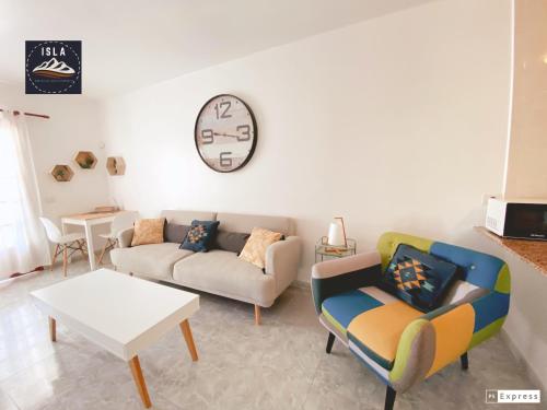 a living room with a couch and a table at Old Town Puerto del Carmen in Puerto del Carmen